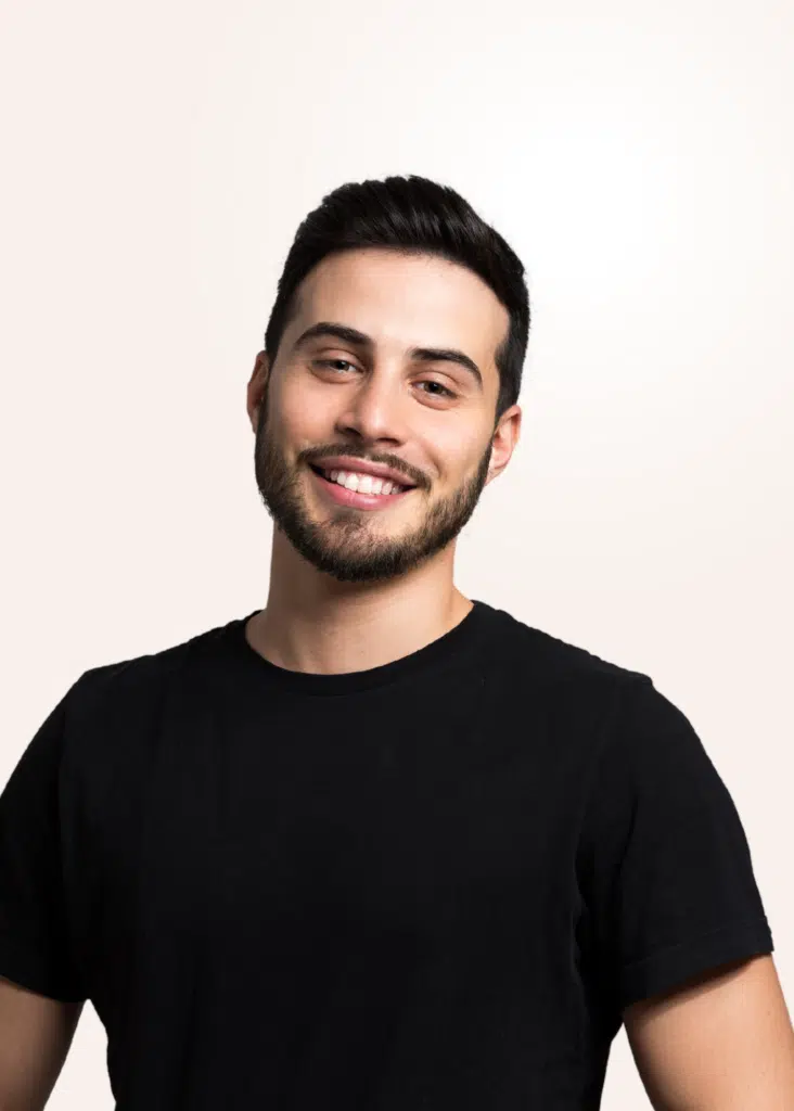 Adult with orthodontic braces smiling - Goodman Orthodontics