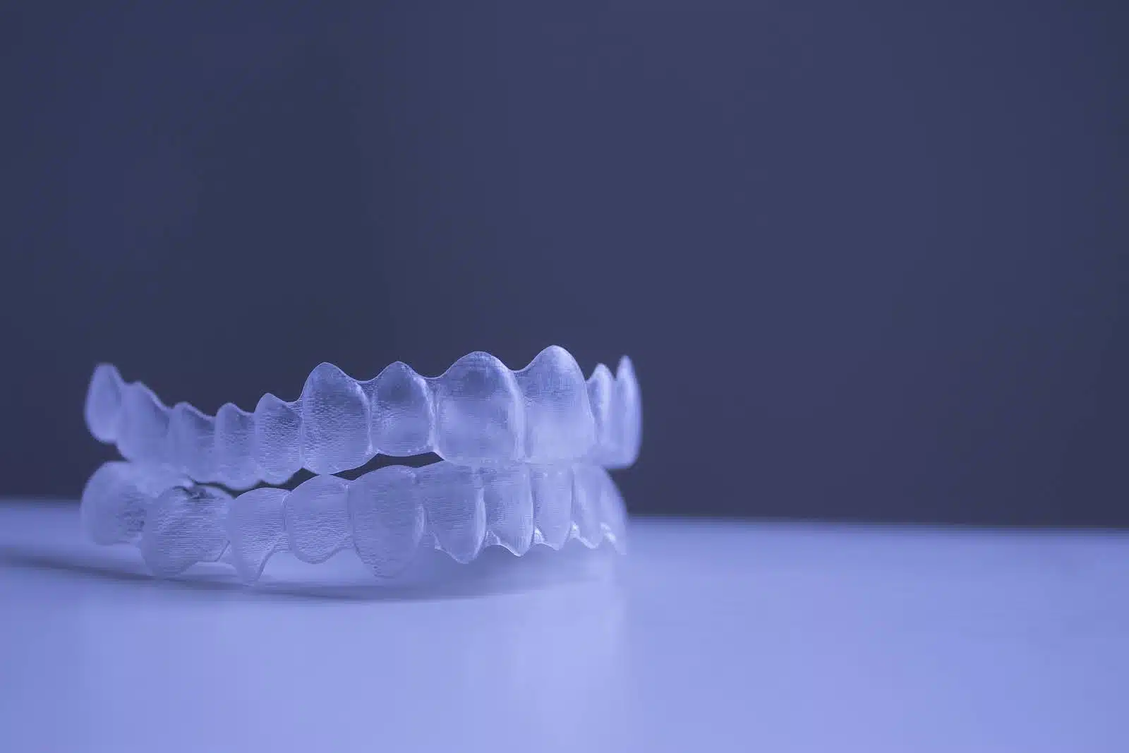 Clear dental aligners displayed to represent Invisalign for teens