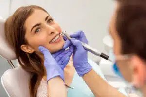 Patient speaking with orthodontist during exam highlighting questions before orthodontic treatment